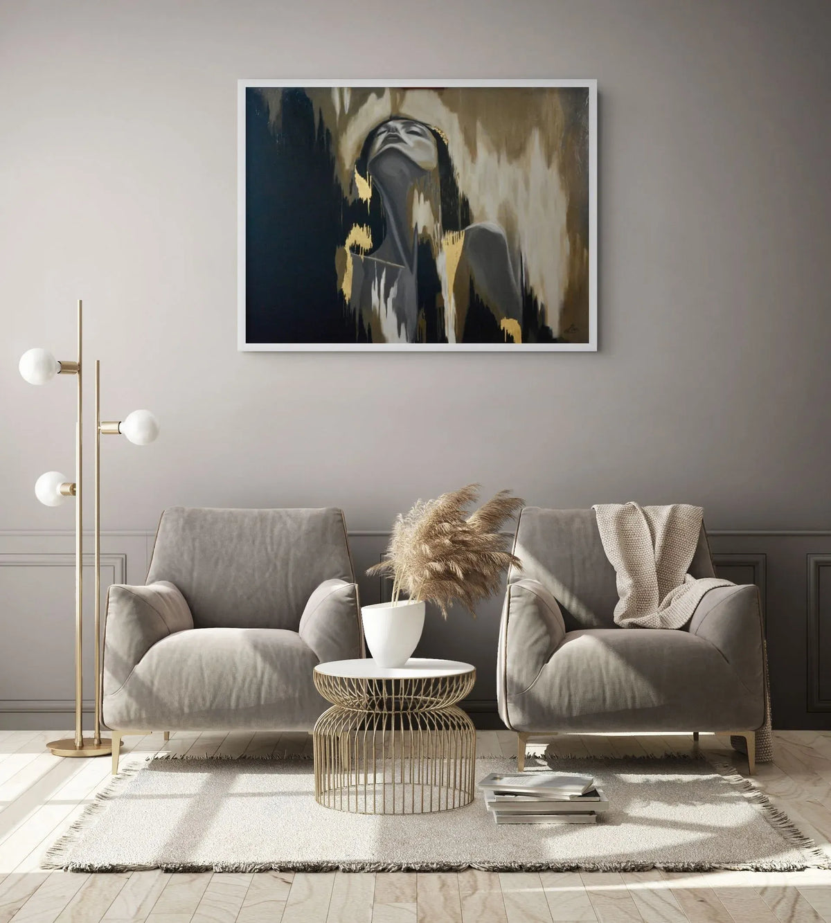 Release mixed media figurative painting with 23K gold leaf displayed in a sophisticated neutral living room hanging above a graey sofa in a modern living room. The artwork features a stylised portrait with black, beige, grey, and gold brushstrokes.