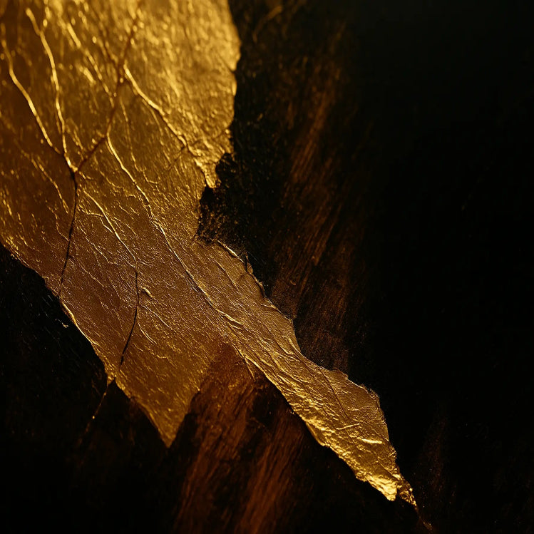 Close-up of a gold leaf on a dark background used on Luxe Wall Art by Lisa website.