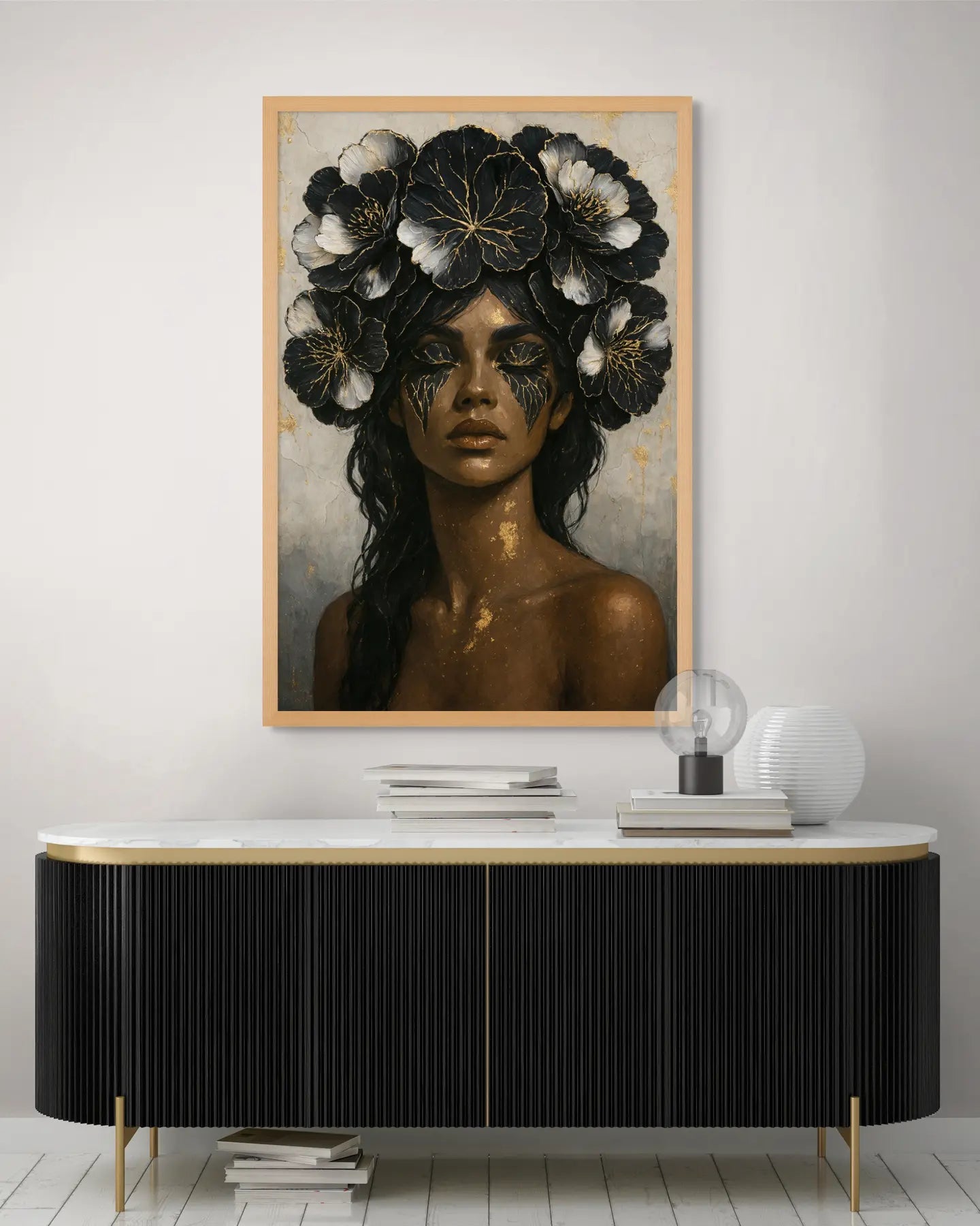 Luxury black and gold floral portrait artwork styled above a modern credenza in a contemporary interior