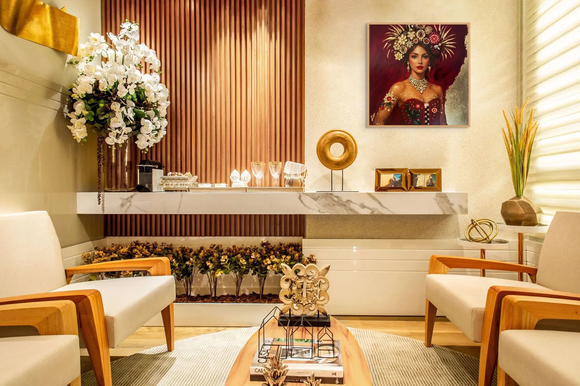 Sophisticated designer interior featuring a glamorous gold leaf portrait painting of an elegant woman with floral headpiece and jewel details, displayed against warm timber wall panelling and marble finishes.