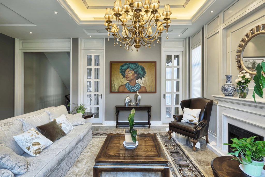 Azulina Glow luxury original gold leaf painting in a living room with a chandelier, sofa, coffee table, and decorative elements.