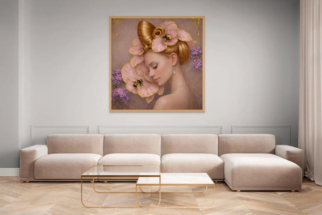 Luxury gold leaf portrait painting Gilded Honey III styled in an oak frame above a light-toned sofa in a refined contemporary living space.