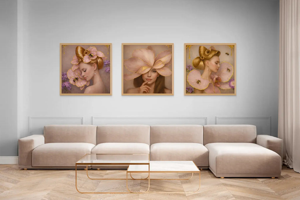 Luxury gold leaf portrait triptych Gilded Honey styled in oak frames above a blush-toned sofa in an elegant living space.