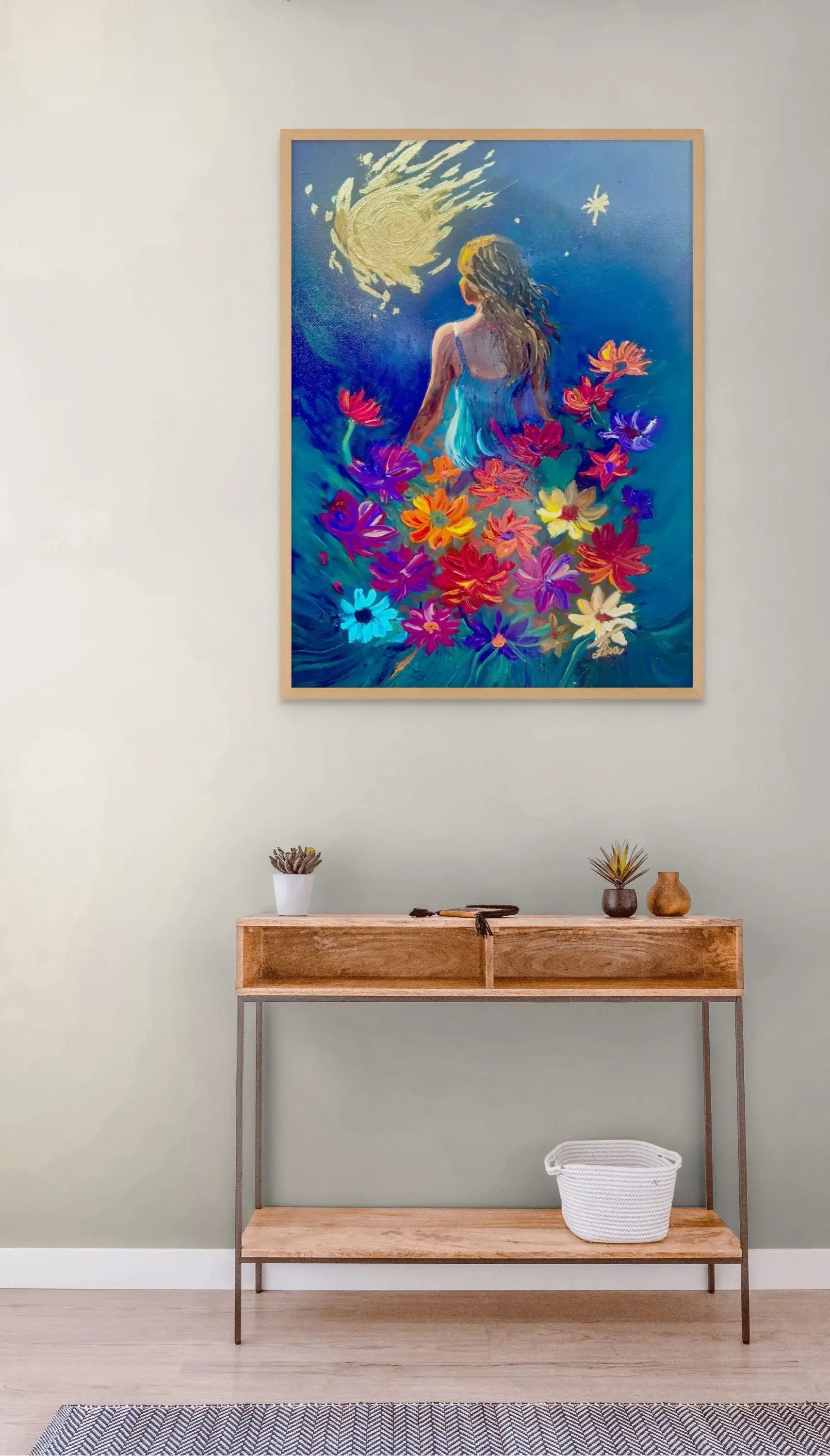 Stellar Petals original artwork in an oak frame displayed above a contemporary dining table.